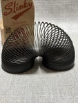 Poof Slinky Collector's Edition Black Metal Spring Toy Standard Size Usa Box. Fixed Price $8.99.