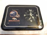 Denver Broncos Rectangular Varnished Football Wall Clock. Fixed Price $40.00.