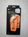 Nike Mercurial Lite Soccer Shinguard; Model SP2120 Orange Xl. Fixed Price $24.00.