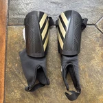 New Med Adidas Tiro Match Junior Football Soccer Shin Guards Black Gold IP3996. Fixed Price $14.89.