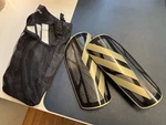 Brand New Adidas Tiro League Shin Guards Black Gold Size With Tags!!. Fixed Price $14.95.